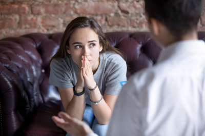 a woman speaking with her doctor